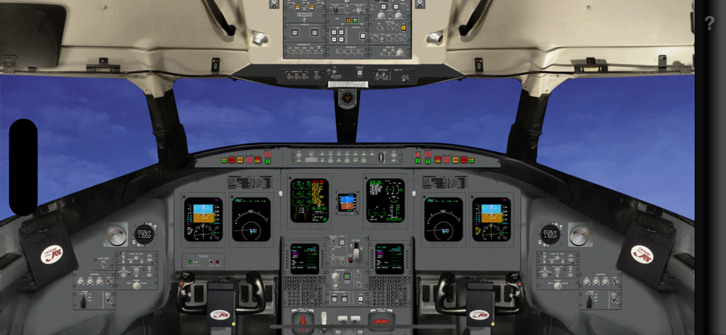 Wide view of the CRJ-700 cockpit showing flight displays and instrument panels