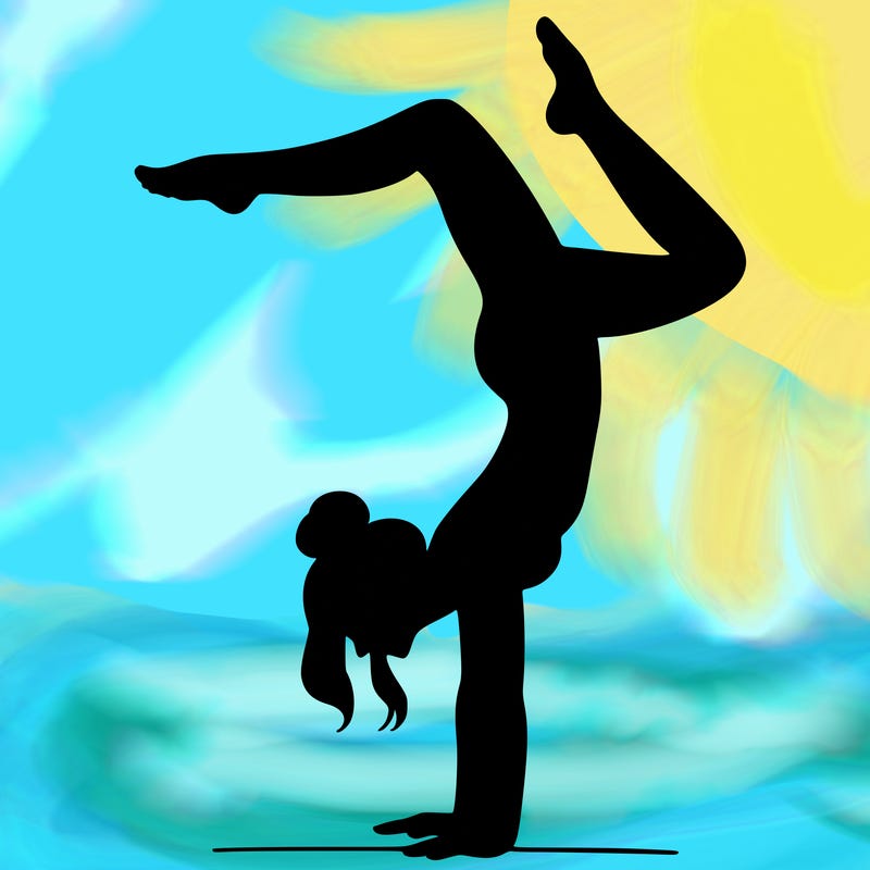 a woman doing a handstand