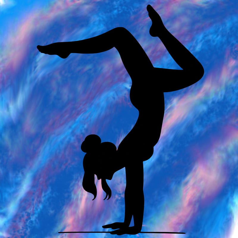 a woman doing a handstand