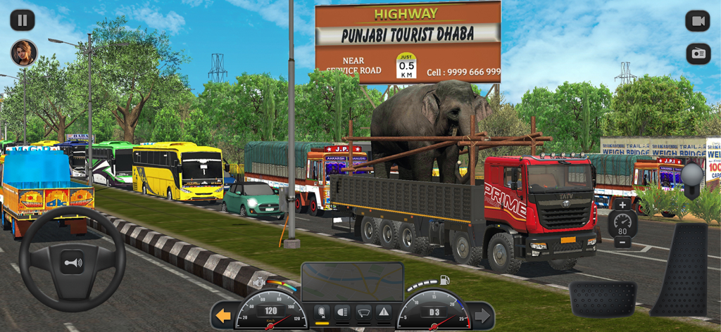 Gameplay screen of Truck Masters India Simulator featuring a red truck carrying an elephant past a Punjabi Dhaba billboard.