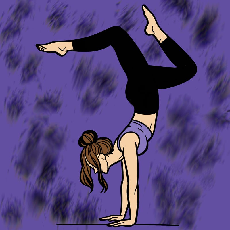 a woman doing a handstand