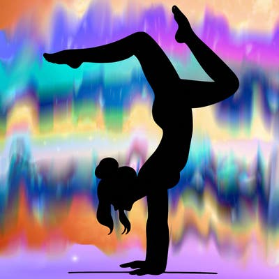 a woman doing a handstand