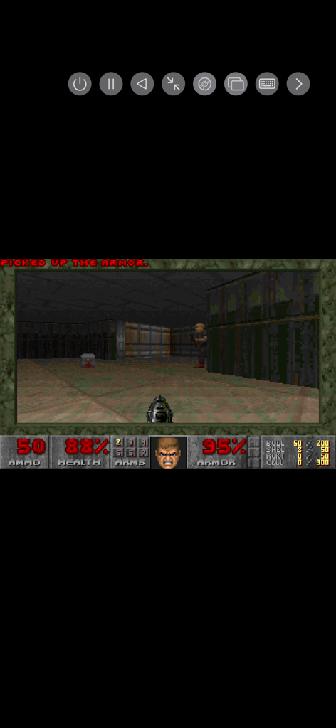 A retro PC emulator running a classic first-person shooter game on an iPhone