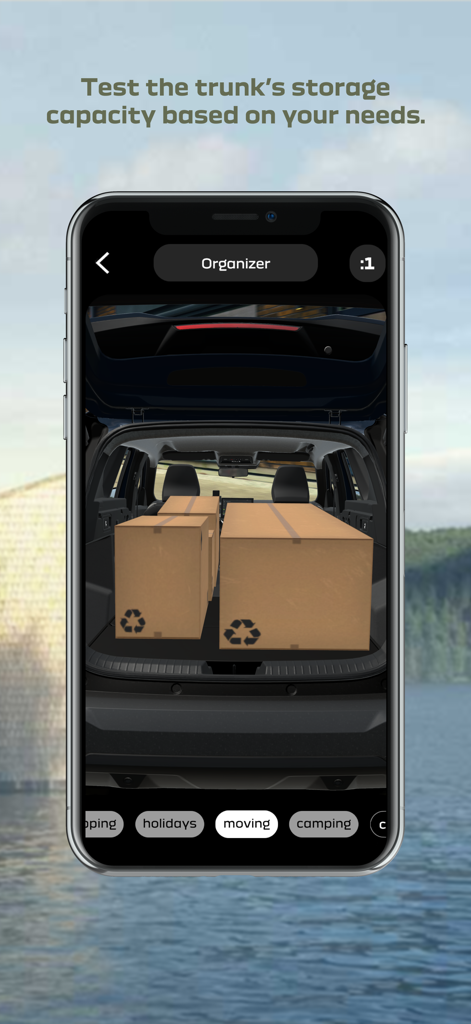 Fonctionnalité d'organisateur de coffre de l'application Dacia AR montrant des boîtes en carton 3D dans le coffre d'une voiture pour tester la capacité de stockage pour un déménagement