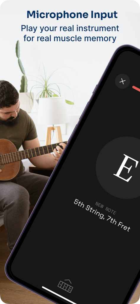 Fret Pro Guitar Notes Trainer - A man practicing notes on an acoustic guitar using the Fret Pro app with microphone input for real time feedback.