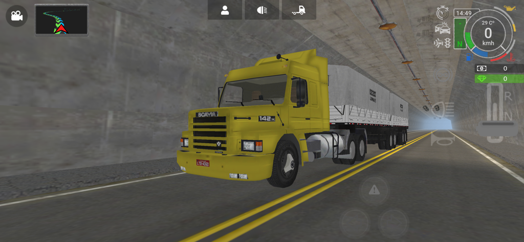 Grand Truck Simulator 2 - A yellow Scania 142H truck driving through a concrete tunnel in Grand Truck Simulator 2