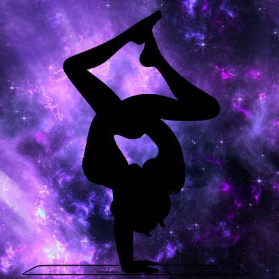 a woman doing a handstand