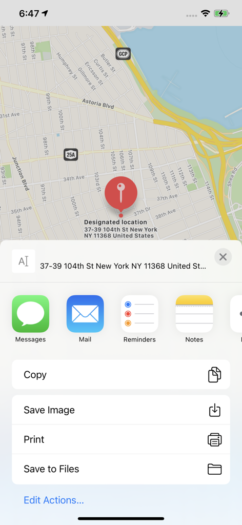 Screenshot of iLocation plus app showing a designated map pin in New York with the iOS share sheet open for messaging and email