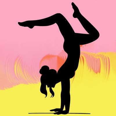 a woman doing a handstand