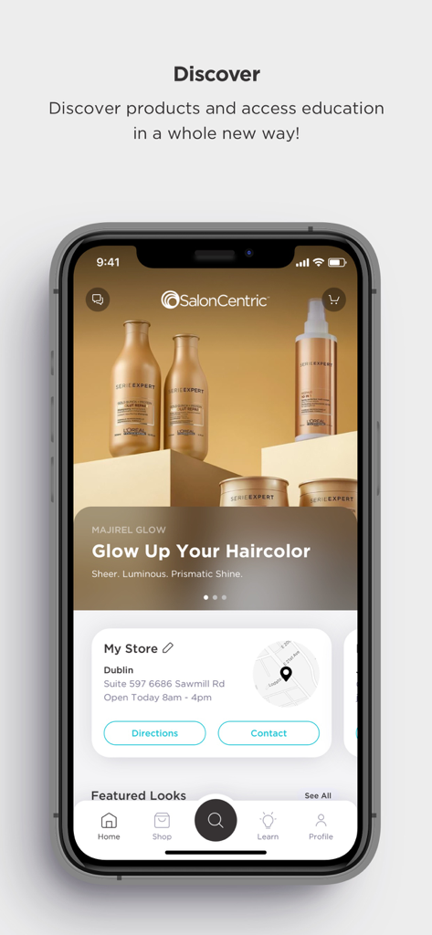 Schermata principale dell'app SalonCentric che mostra prodotti per capelli professionali e una sezione per trovare negozi locali.