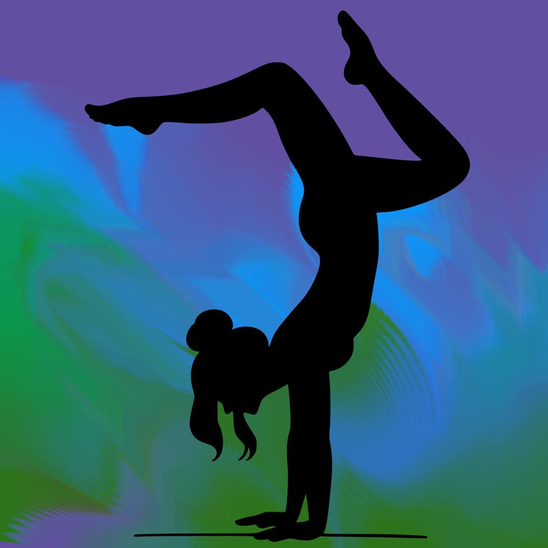 a woman doing a handstand
