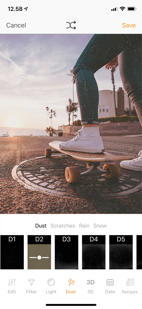 KUNI Cam: Photo Video Editor. - Interfaz de la app KUNI Cam mostrando efectos de polvo vintage aplicándose a la foto de una persona en patineta