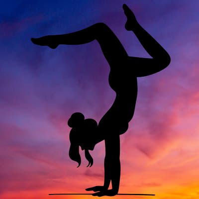 a woman doing a handstand