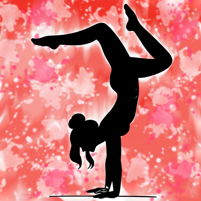 a woman doing a handstand