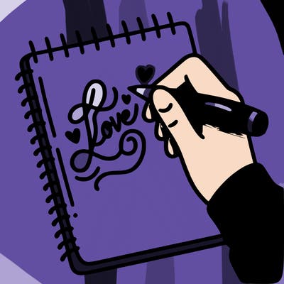 a hand writing “love” in calligraphy on a notebook