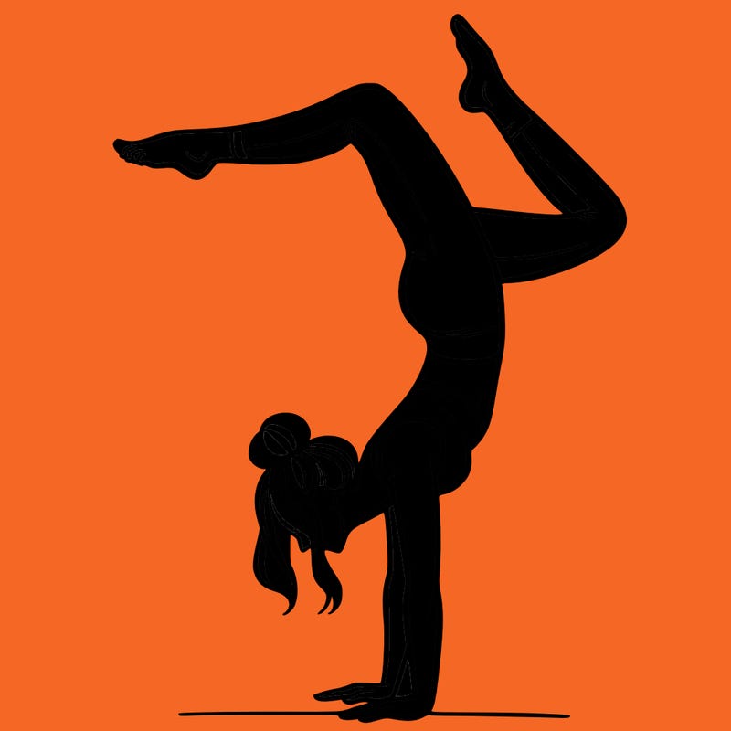 a woman doing a handstand