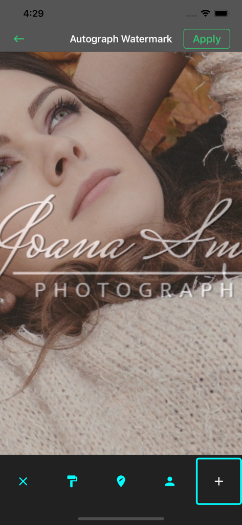 A mobile interface demonstrating the autograph watermark feature on a portrait photograph