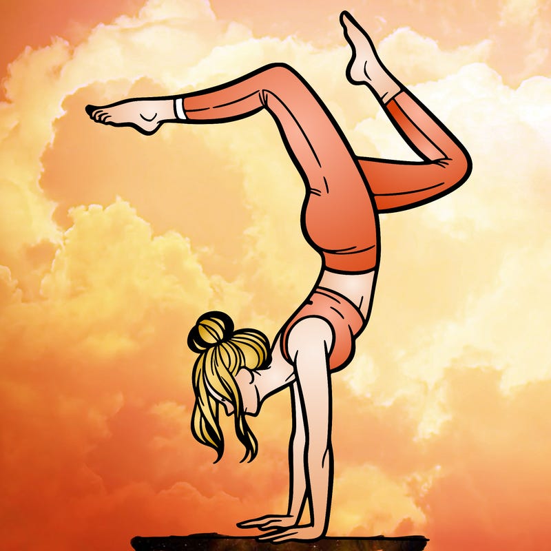 a woman doing a handstand