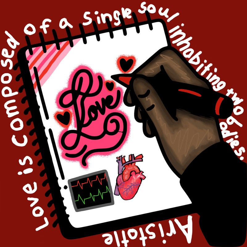 a hand writing “love” in calligraphy on a notebook