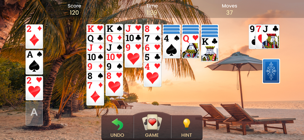 Klondike Solitaire game being played with a relaxing tropical beach sunset background