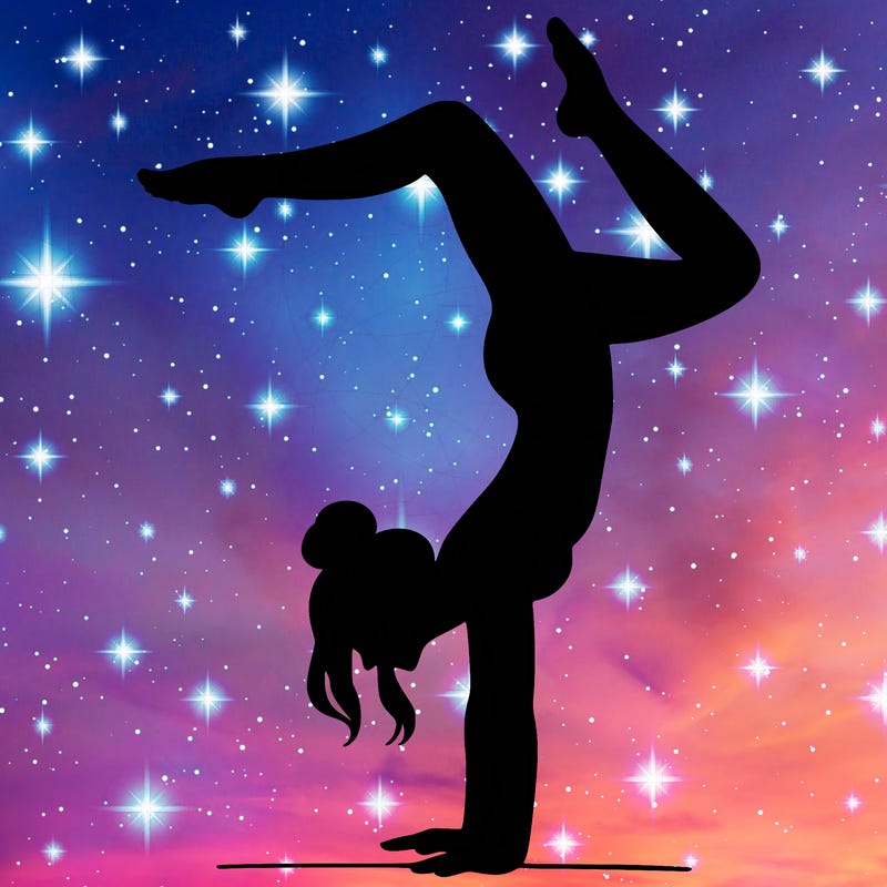 a woman doing a handstand