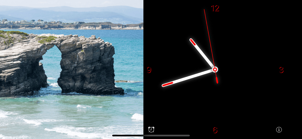 Standby Alarm Clock - A minimalist analog clock with red accents displayed next to a scenic coastal rock arch photo