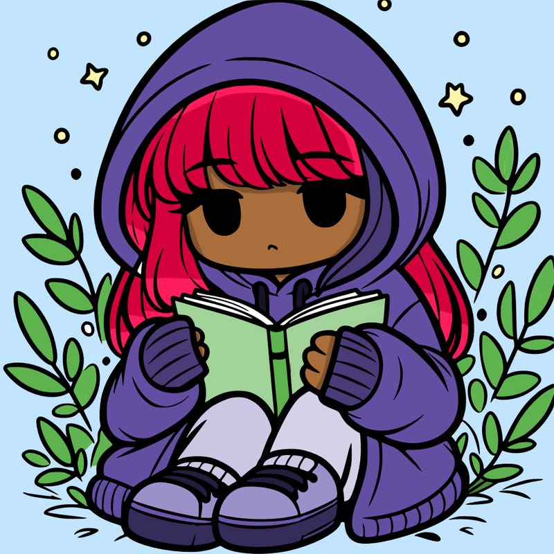 girl in oversized hoodie reading a book