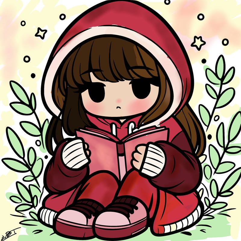 girl in oversized hoodie reading a book