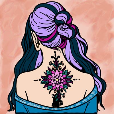 pretty tattoo on back of woman’s neck