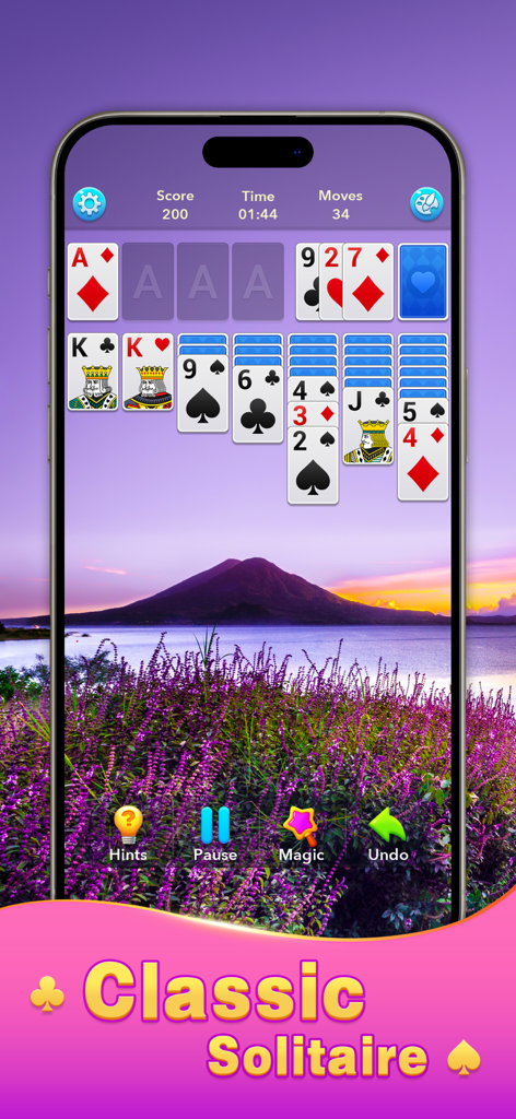 Solitaire Klondike! - Screenshot of Solitaire Klondike gameplay on a mobile phone with a beautiful mountain and purple flower field background.