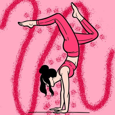 a woman doing a handstand