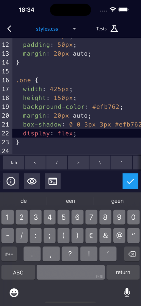 freeCodeCamp - A mobile code editor interface in the freeCodeCamp app showing a CSS challenge with a specialized coding keyboard