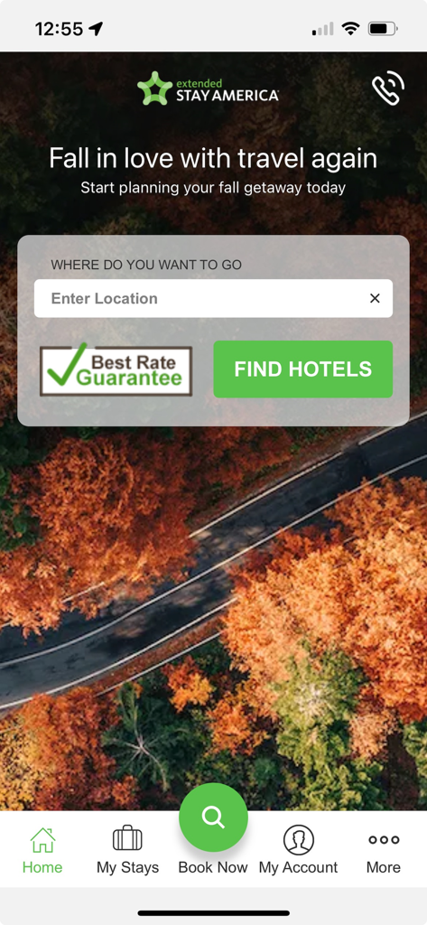 Extended Stay America - Home screen of the Extended Stay America app featuring a hotel search bar and Best Rate Guarantee badge over an autumn landscape background