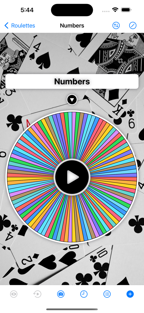 Roulette - Decision Roulette - Colorful decision roulette wheel with a playing cards background