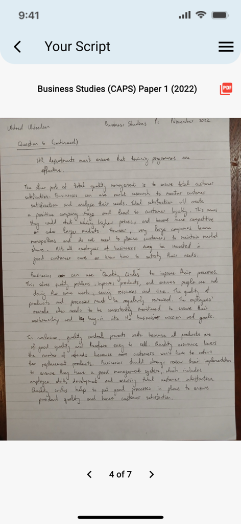 ExamEase - A handwritten student essay for a business studies exam being reviewed within the ExamEase app interface.