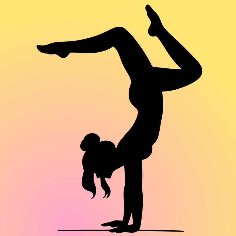 a woman doing a handstand