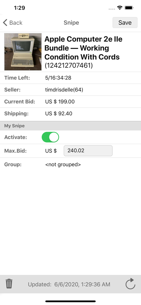 Pantalla de la aplicación Myibidder mostrando detalles de la subasta y configuración de puja máxima para un lote de ordenadores Apple vintage