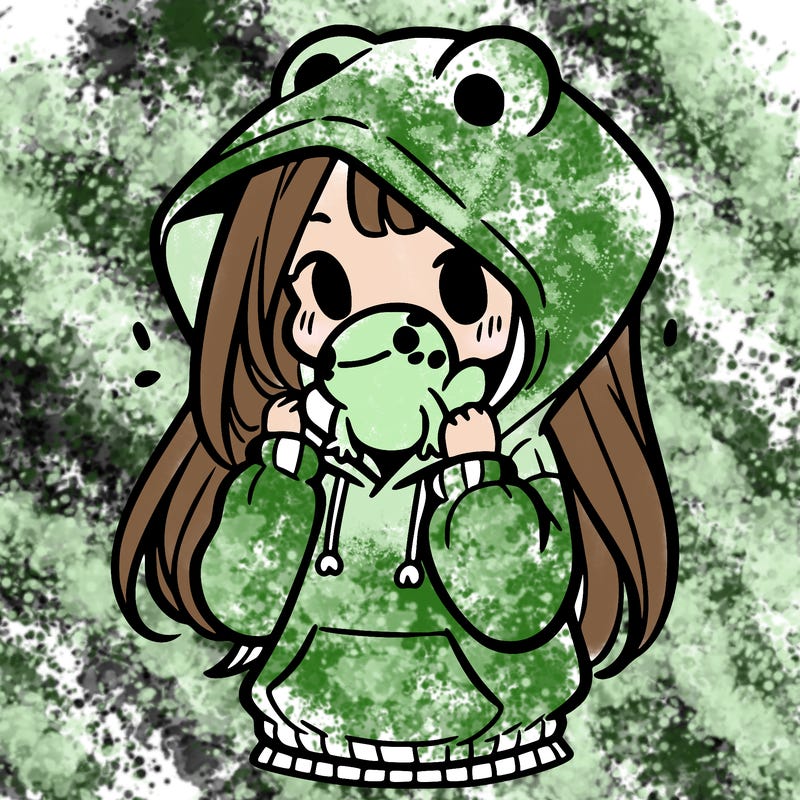 a girl holding a froggy hoodie