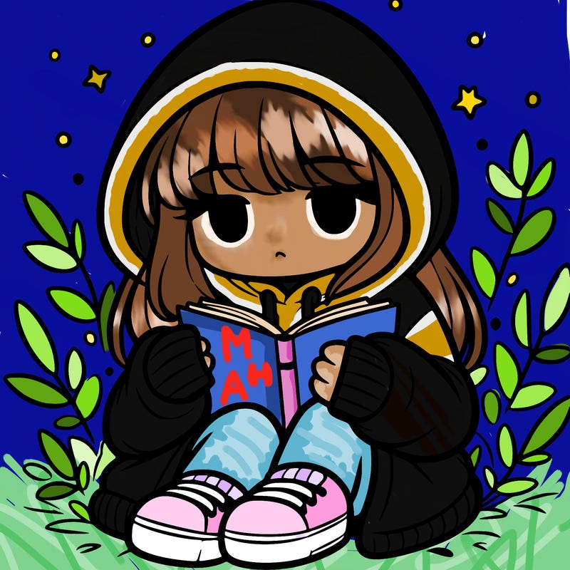 girl in oversized hoodie reading a book