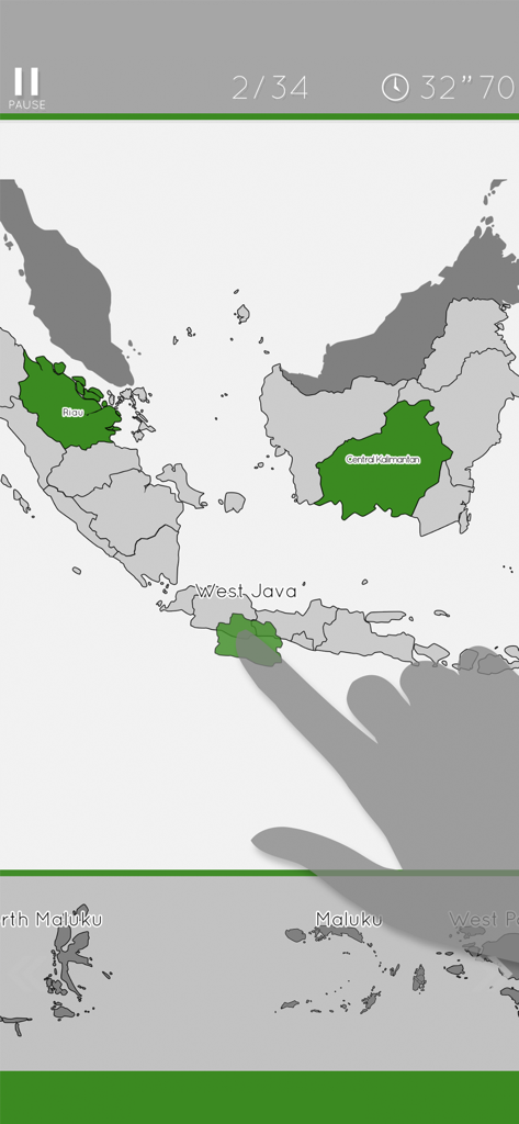 A hand dragging the West Java province piece into place on the map in the Indonesia Map Puzzle game.