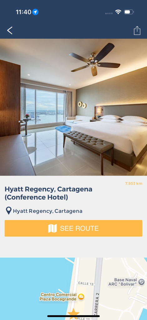 WEO Connects - Uma tela móvel do aplicativo WEO Connects exibindo informações do hotel da conferência para o Hyatt Regency Cartagena, incluindo uma foto do quarto e um mapa