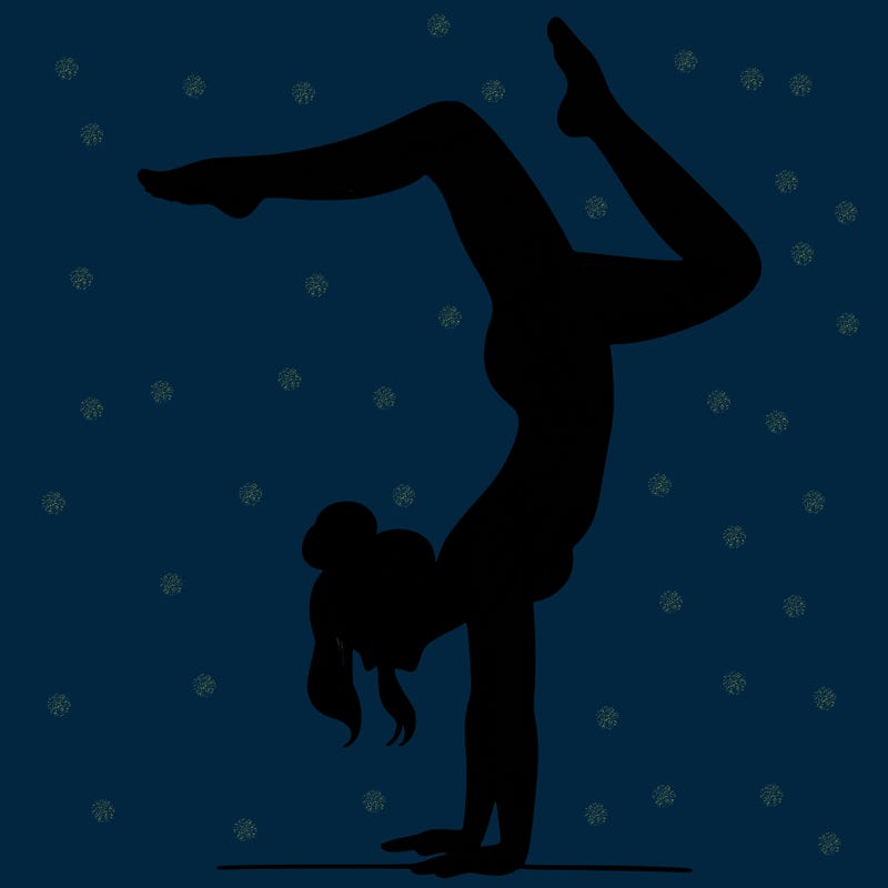 a woman doing a handstand