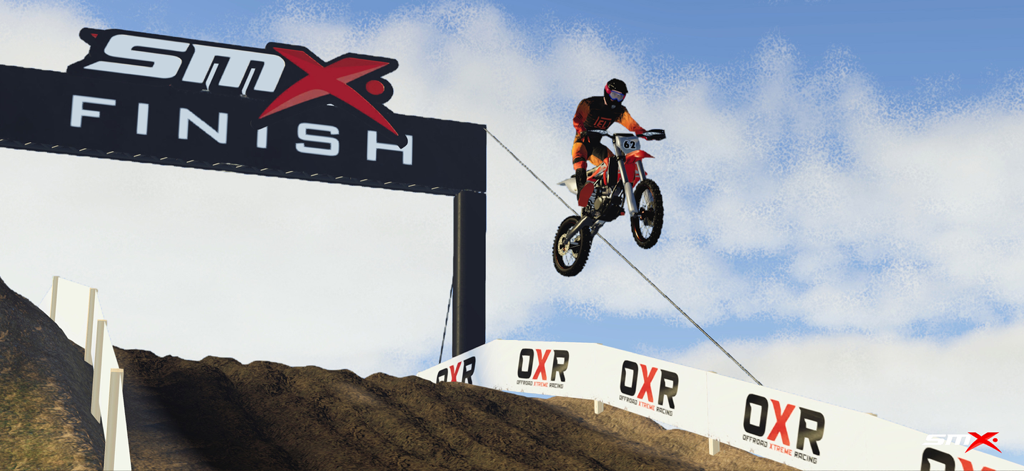 A motocross rider performing a high jump near the finish line in the SMX mobile game