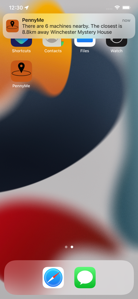 PennyLocator - An iPhone home screen showing a push notification from the PennyMe app alerting the user to nearby pressed penny machines.