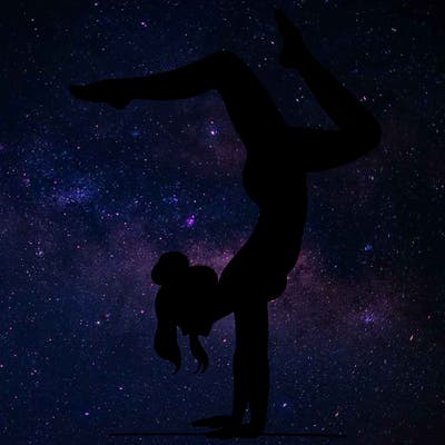 a woman doing a handstand