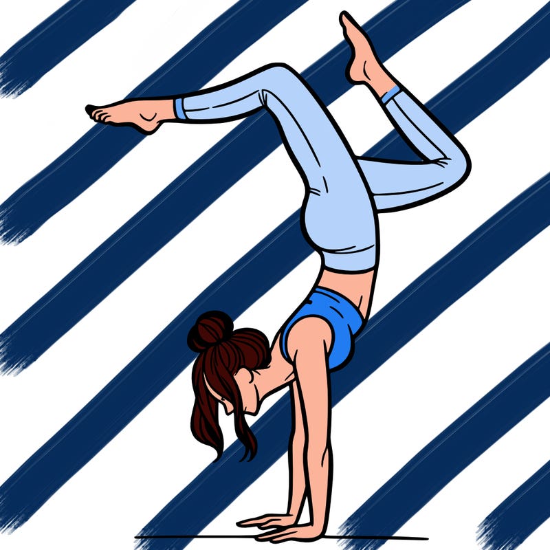 a woman doing a handstand