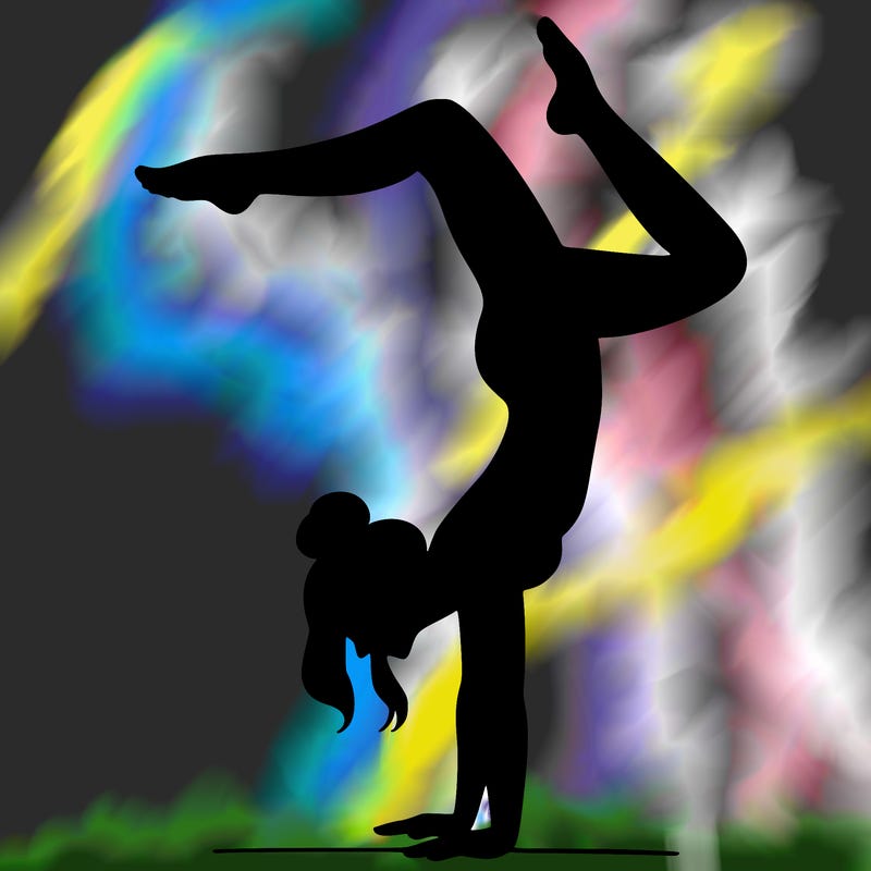 a woman doing a handstand