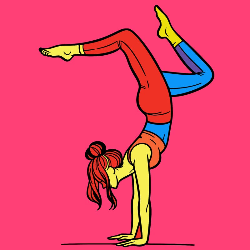 a woman doing a handstand