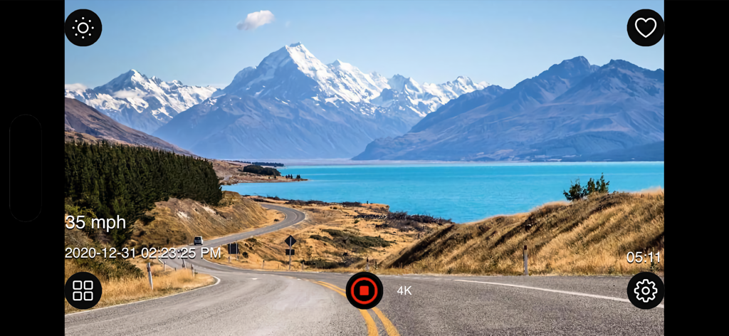 Dash Cam Plus - Dash Cam Plus app recording a scenic mountain road trip with speed and timestamp overlays in 4K resolution.