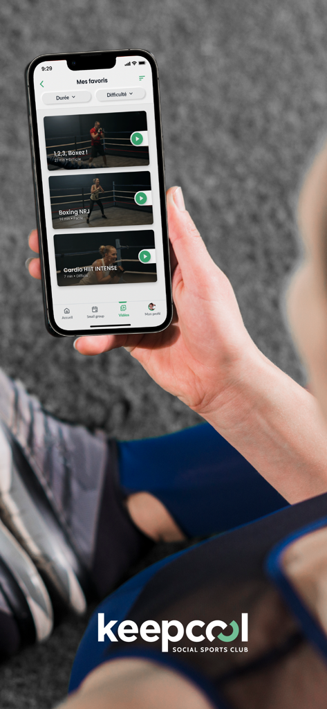 Smartphone showing boxing and HIIT workout videos in the Keepcool app